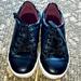 Michael Kors Shoes | Michael Kors Black Leather With Plum Trim Sneakers | Color: Black/Purple | Size: 13g