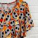 Disney Tops | New Disney X Lularoe Nightmare Before Christmas Irma Top | Color: Orange | Size: M