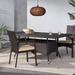 Outdoor rectangular wicker dining table, often brown