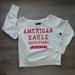 American Eagle Outfitters Tops | American Eagle Sweatshirt Spellout Off-White Red Logo Large Pullover Scoop | Color: Red/White | Size: L