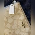 Coach Bags | Coach Signature Canvas Double Corner Zip Wrist Wallet | Color: Tan/White | Size: 6 1/2" (L) X 3 3/4" (H) X 1 3/4" (W)