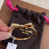 Kate Spade Jewelry | Kate Spade Love Notes Gold Plated Pave Crystal Bow Bangle Bracelet Bnwt | Color: Gold | Size: Os