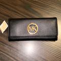 Michael Kors Bags | Michael Kors Black Fulton Flap Continental Leather Wallet Clutch | Color: Black/Gold | Size: Os