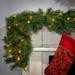 The Holiday Aisle® 9' Grasmick Pre-Lit Garland w/ 100 & Warm Clear/White Lights in Green | 1 H x 108 W x 14 D in | Wayfair