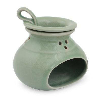 Celadon ceramic oil warmer, 'In Harmony'