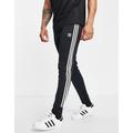 adidas Originals adicolor three stripe skinny joggers in black - BLACK