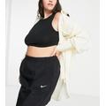 Nike Plus Essential woven high waisted skirt in black