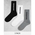 Salomon 3 pack of everyday unisex crew socks in white black and grey