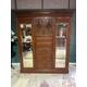 Victorian mahogany compactum wardrobe having two upper central carved cupboard doors with internal shelf, over five graduates drawers