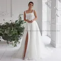 Robe de mariée de luxe ligne A appliques de perles de fibre col carré fente haute longueur au