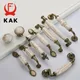 KAK Linee di marmo Maniglie per mobili in ceramica Manopole per cassetti in lega di zinco Maniglie per porte per guardaroba Maniglia per mobili europei in bronzo antico