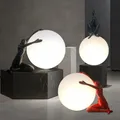 Nordic art floor lamp abstract decoration of human figure holding ball vertical lamp creative figure