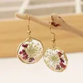 Boucles d'oreilles rondes élégantes pour femmes fleur séchée unique boucles d'oreilles naturelles