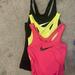 Nike Tops | 3 Nike Drop-Fit Nike Pro Tank Tops Xs | Color: Black/Green/Pink/Tan/Yellow | Size: Xs