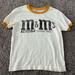 American Eagle Outfitters Tops | American Eagle Xs M&M Graphic Tee | Color: White | Size: Xs