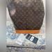 Louis Vuitton Bags | Louis Vuitton Bucket Handbag Large 100% Authentic. Pre-Owned | Color: Brown | Size: Os