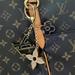 Louis Vuitton Jewelry | Louis Vuitton Metal Enamel Fleur De Monogram Bag Charm Dore | Color: Blue/Gold | Size: Os