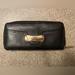 Michael Kors Bags | Michael Kors Black Leather Wallet With Gold Engraved "Michael Kors" Plate | Color: Black | Size: Os