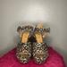 Jessica Simpson Shoes | Jessica Simpson Glitter Cheetah Print Heels | Color: Black/Gold | Size: 8