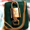 Louis Vuitton Jewelry | Louis Vuitton Lock W/ Key On A Gold Tone Chain | Color: Gold | Size: Os