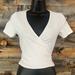 Brandy Melville Tops | Brandy Melville Top/Crop Top With Tie That Wraps Around Back, White | Color: Black | Size: 0