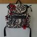 Coach Bags | Coach "Daisy" White/Black/Red Floral-Logo Print Fabric Backpack | Color: Black/White | Size: Os