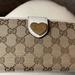 Gucci Bags | Gucci Long Wallet. Very Nice Condition. Snaps Work. Heart Gucci Snap. Today Only | Color: Brown/Cream | Size: 4x7.5