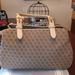 Dooney & Bourke Bags | Euc Dooney & Bourke Signature Satchel Tote Tan Canvas W/ Leather Trim | Color: Tan | Size: 14" X 9"