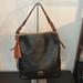 Dooney & Bourke Bags | Dooney & Bourke Black Pebble Grain Leather Brown Leather Detail Shoulder Sac | Color: Black/Brown | Size: Os