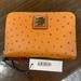 Dooney & Bourke Bags | Dooney & Bourke Nwt Saffiano Leather Medium Zip Around Credit Card Case Wallet | Color: Orange/Tan | Size: Medium Size Zip Around Wallet