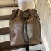 Dooney & Bourke Bags | Dooney Bourke Charcoal Brown Leather Drawstring Bucket Feeder Shoulder Bag | Color: Brown/Gray | Size: Os