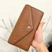 Michael Kors Bags | Michael Kors Jet Set Travel Lg Logo Embossed Leather Envelope Wallet | Color: Brown | Size: Os