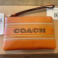 Coach Bags | Coach Corner Zip Wristlet With Coach Stripe | Color: Brown/Orange | Size: Measures: 6 1/4" (L) X 4" (H) X 1/2" (W)