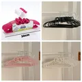 5 pezzi Hello Kitty Bowknot appendiabiti in plastica Kawaii Sanrio Anime periferiche dormitorio creativo carino appendiabiti senza tracce regalo