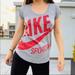 Nike Tops | Nike Red Swoosh Sportswear Big Red Logo Letters Graphic Gray Top Tee S | Color: Gray/Red | Size: Various