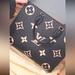 Louis Vuitton Bags | Black & Beige On The Go Mm Louis Vuitton Bag. | Color: Black/Cream | Size: Os