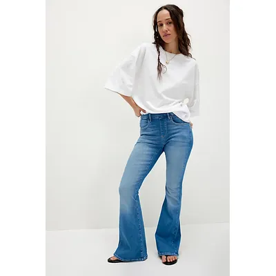 CRVY Infinite Stretch Pull-On Flare Jeans by We The Free at Free People in Mid Indigo, Size: Small