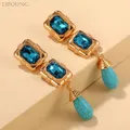 Boucles d'Oreilles Pendantes en Métal RapMetal pour Femme Longue Goutte Turquoise Document