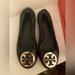 Tory Burch Shoes | Authentic Tory Burch Flats In Black With Silver Emblem. Size 9 | Color: Black | Size: 9