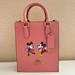 Coach Bags | Disney X Coach North South Mini Tote With Ice Skate Motif | Color: Gold/Pink | Size: Os