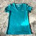 Under Armour Tops | Euc | Ladies Under Armour Semi Fitted V Neck | Teal W/ Silver Sparkle | Size S | Color: Blue/Silver | Size: S