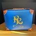Disney Bags | Disney Parks Exclusive, Riviera Resort Mini Suitcase Bag, Nwt | Color: Blue/Brown | Size: Os