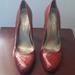 Jessica Simpson Shoes | Jessica Simpson Red Snakeskin Round Toe High Heel Pumps Size 8. | Color: Red | Size: 8