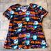 Disney Tops | Disney Nightmare Before Christmas Jack Skellington Scrub Top Size Medium | Color: Black/Orange | Size: M