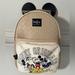 Disney Bags | Disney - Nwt - Limited Edition - 100 Years Anniversay Backpack | Color: Cream/Tan | Size: 9.5 X 12.5 X 6.5
