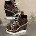 Jessica Simpson Shoes | Jessica Simpson Meliney Wedge Sneaker Animal Print Size 7 | Color: Black/Brown | Size: 7
