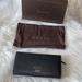 Gucci Bags | Gucci Pebbled Leather Long Fold Over Wallet Nwt | Color: Black | Size: Os