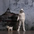 Banksy a trendy man playing with dogs white fashion toys art sculptures and ornaments