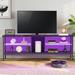 Wrought Studio™ Entertainment Center, Gaming TV Stand For 60 TV Inch, TV Media Console w/ Glass Shelves, LED Lights Wood/Metal in White/Black | Wayfair