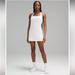Lululemon Athletica Dresses | 708. Lululemon Athletica Lightweight Tennis Dress In White Nwt Size 4 | Color: White | Size: 4